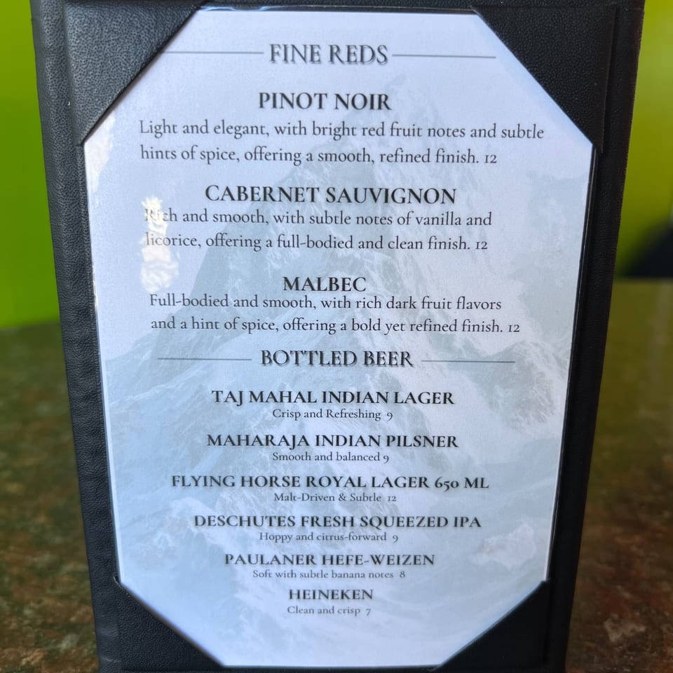 Close-up of India Express Denver's drink menu, featuring fine red wines and bottled Indian and international beers.